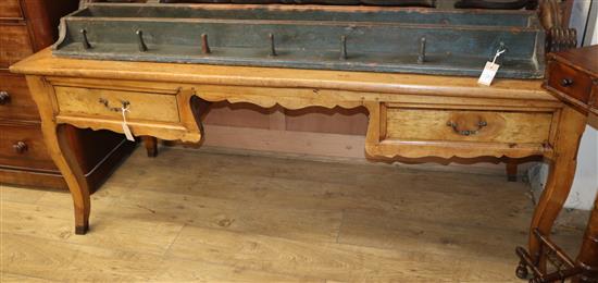A French fruitwood writing table W.188cm